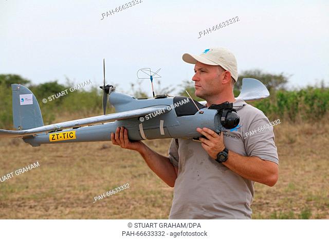 An Air Shepherd pilot prepares a drone for take-off in the Hluhluwe-Imfolozi Park located in KwaZulu-Natal province, South Africa, 15 February 2016