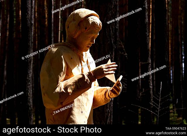RUSSIA, IRKUTSK REGION - MAY 13, 2023: A participant’s work is on display at the 10th Lukomorye Na Baikale international wood sculpture festival