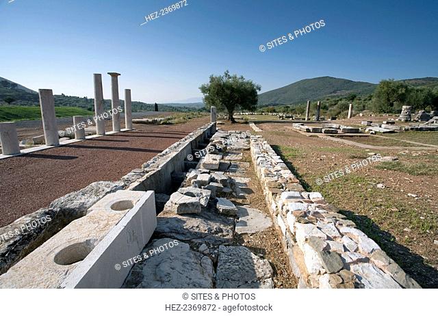 A latrine in Messene, Greece. Ancient Messene lies on the slopes of Mt Ithomi, 30km/19 miles northwest of Kalamata. It was founded by Epaminondas in 369 BC...