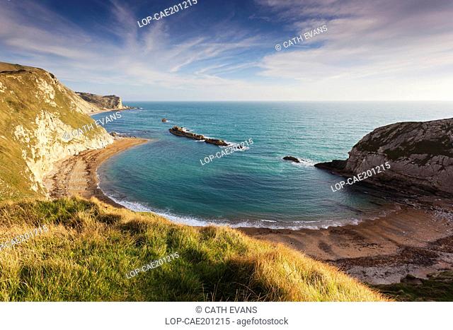 England, Dorset, Man O' War Bay. Man O' War Bay on the Jurassic Coast, part of St Oswald's Bay. The rocks in the sea are said to look like war ships
