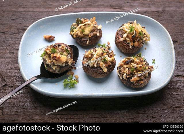Brown mushrooms stuffed with mushroom-walnut mixture