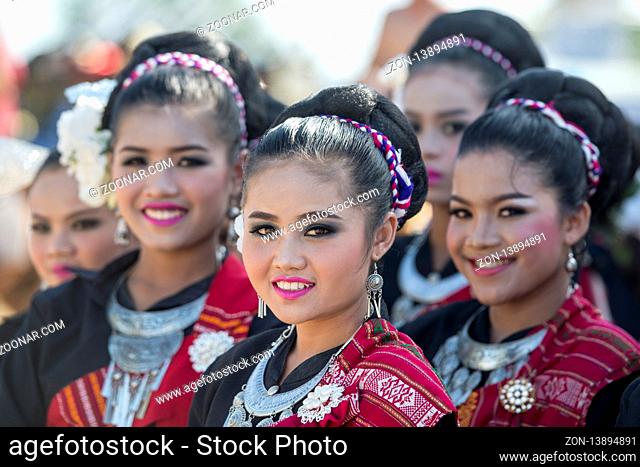 traditional dressed thai Dance women at the traditional Elephant Round Up Festival in the city of Surin in Isan in Thailand