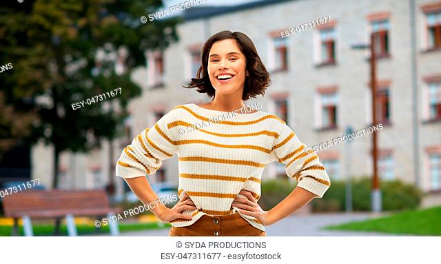 smiling woman or student girl with hands on hips