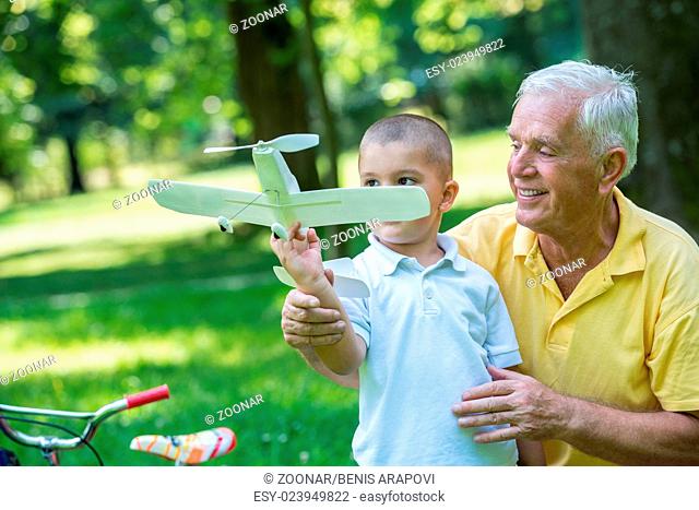 grandfather and child have fun in park