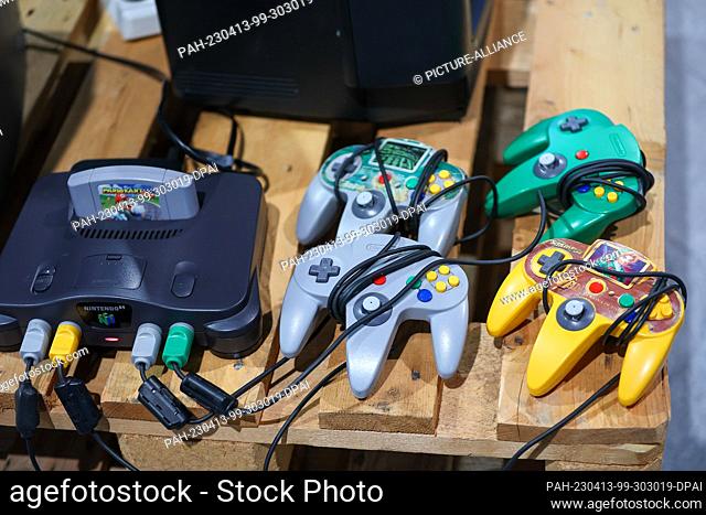 13 April 2023, Saxony, Leipzig: A Nintendo 64 game console lies in a retro area of the ""CAGGTUS"" gaming festival at the Leipzig Fair