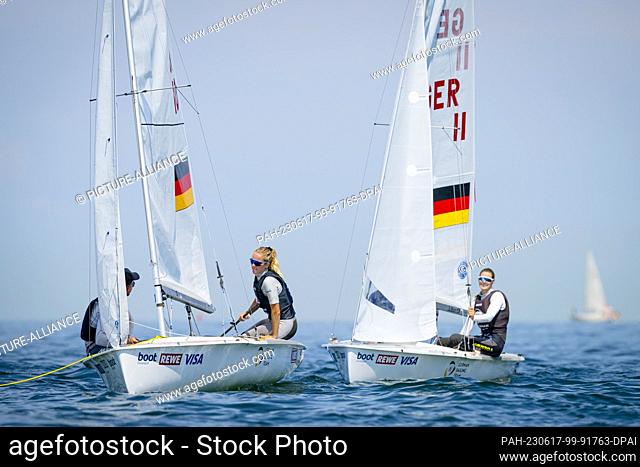 17 June 2023, Schleswig-Holstein, Kiel: Sailing: Kiel Week - Olympic classes. On the first day of competition there is calm on the Kiel Fjord