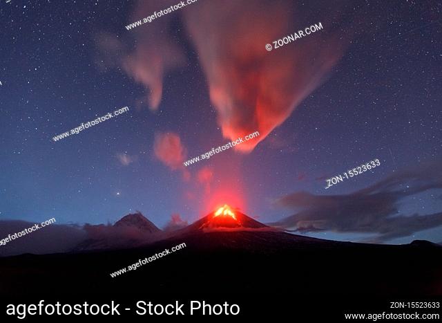 Beautiful volcanic landscape of Kamchatka Peninsula: night view of eruption active Klyuchevskaya Sopka or Klyuchevskoy Volcano