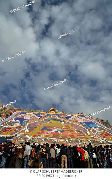 Tibetan Buddhism, visitors of the Thangka, a giant Buddha image is unfurled during the Shoton, Sho Dun or Yoghurt Festival, Drepung Monastery, Lhasa, Tibet