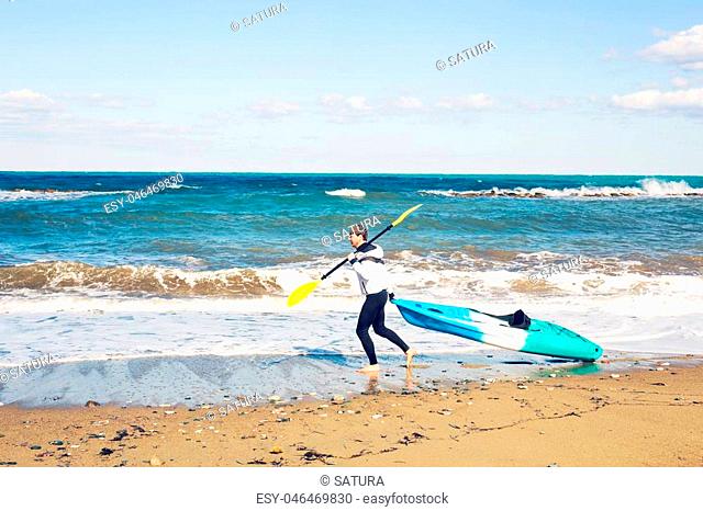 Summer Water Sport. Handsome Athletic Man With Sexy Body Holding Transparent Canoe Kayak. Beautiful Male Model Having Fun At Tropical Sea Beach