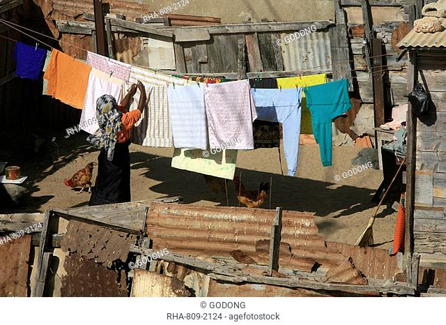 Woman drying laundry, St. Louis, Senegal, West Africa, Africa