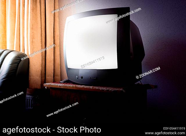 Vintage Television on wooden antique closet, old design
