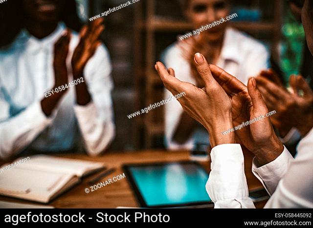 Happy Business People Applauds Together, Diverse Team Of Coworkers Celebrating Agreement With Business Partners While Sitting At Wooden Negotiation Table