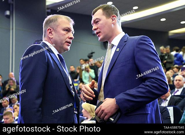RUSSIA, MOSCOW REGION - DECEMBER 19, 2023: Khabarovsk Territory's Governor Mikhail Degtyarev (R) and Central Election Commission member Alexander Kurdyumov...
