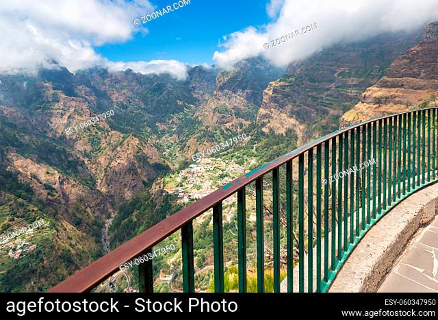 View from high-level viewpoint at sun-drenched mountain village Curral das Freiras at Madeira Island, Portugal