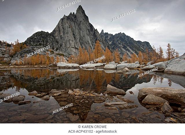 Prusik Peak and Larches Reflected in Gnome Tarn, Upper Enchantments, Alpine Lakes Wilderness, Washington State, USA