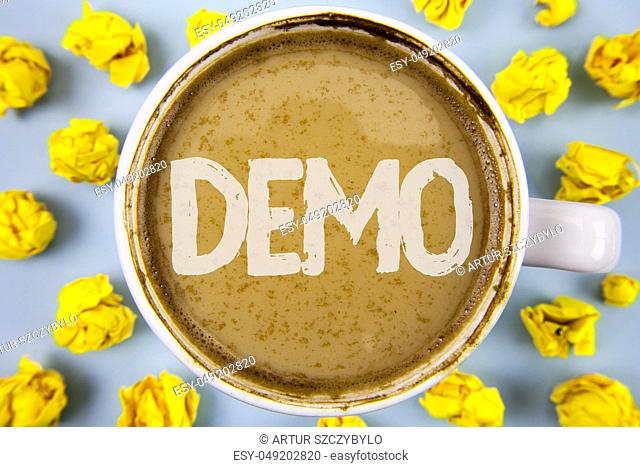 Conceptual hand writing showing Demo. Business photo text Demonstration of products by software companies are displayed annually written Coffee in Cup within...