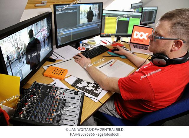 Festival employee Rene Bluemel prepares films for screening at the DOK festival in Leipzig,  Germany, 26 October 2016. This year's documentary film festival...
