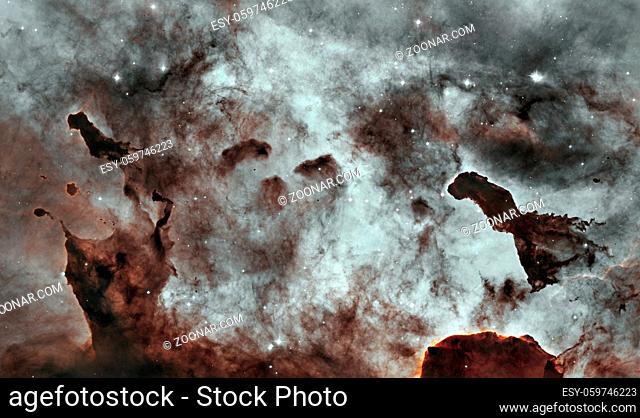 Dust Pillars in the Carina Nebula, also known as the Grand Nebula. Large bright nebula that has within its boundaries several related open clusters of stars