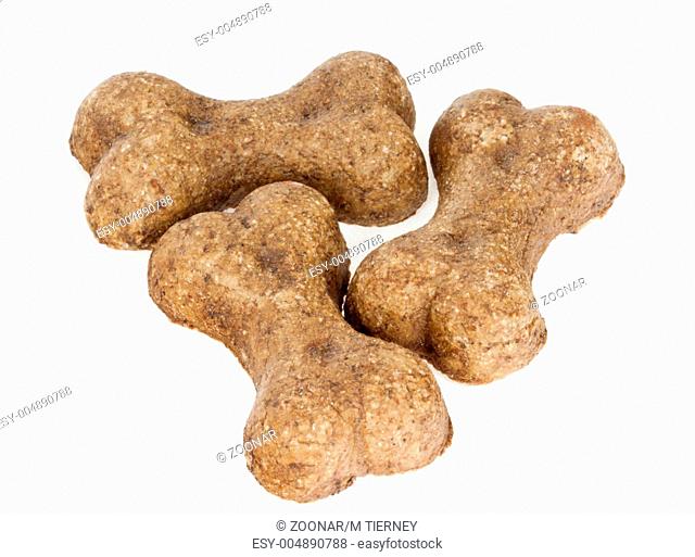 Three dog biscuits isolated on white background