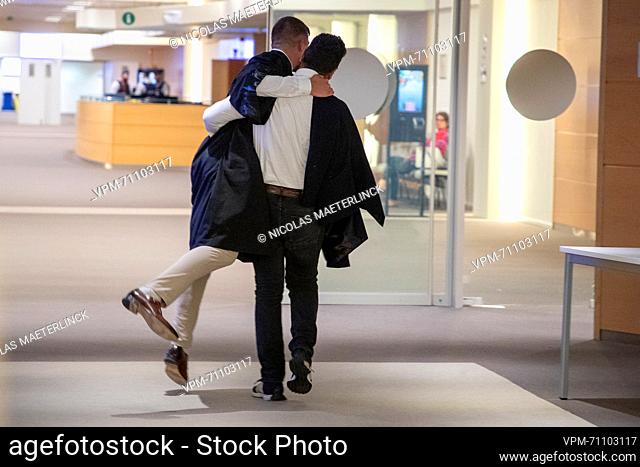 Ibrahim Farisi embraces lawyer Michel Degreve after receiving a not-guilty verdict at a session to read the verdict of the trial of the terrorist attacks of...