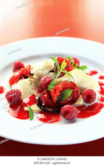 Cream cheese dumplings with tomatoes and raspberry sauce