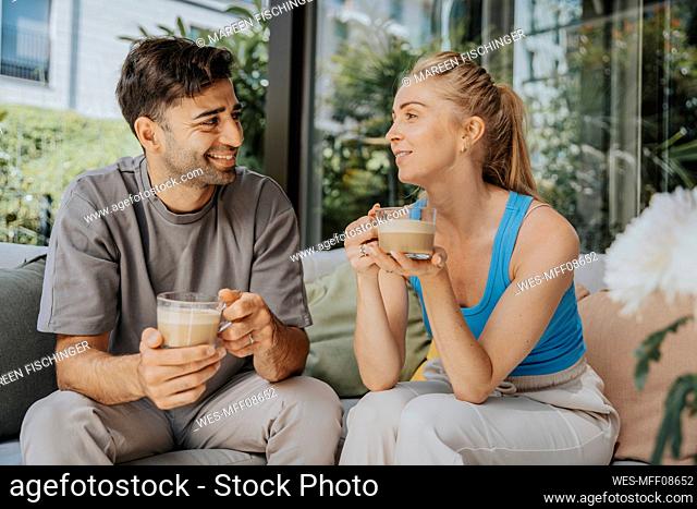 Couple having coffee together at cafe