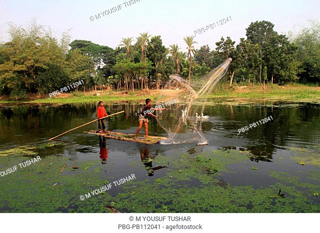 Bangladesh is crisscrossed with rivers and canals It is a common scene in the rural especially the lowland areas to see people busy catching fish Gopalgonj