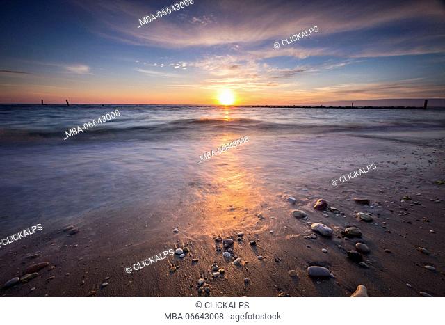 The lights of dawn are reflected on the sandy beach Porto Recanati Province of Macerata Conero Riviera Marche Italy Europe