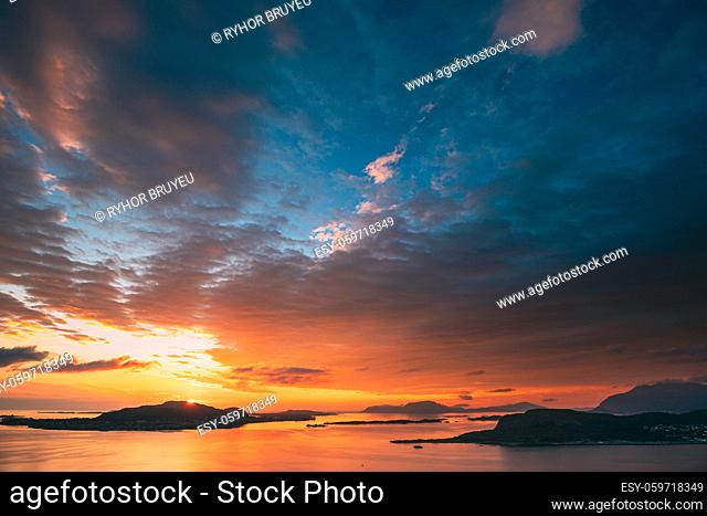 Alesund, Norway. Amazing Natural Bright Dramatic Sky In Warm Colours Above Alesund Valderoya And Islands In Sunset Sunrise Time