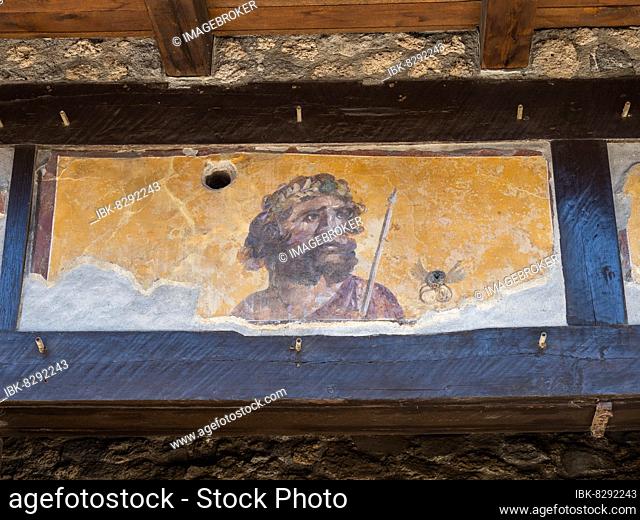 Painted head of a patron god, Taberna of the Four Deities, Via dellAbondanza, ancient city of Pompeii, Campania, Italy, Europe