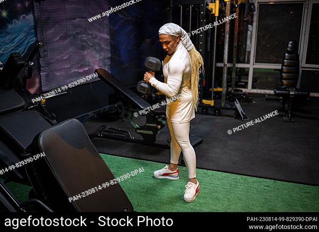 PRODUCTION - 10 August 2023, Iran, Teheran: Sara Mustafanejad, bodybuilder, poses in her gym in the capital Tehran. As one of Iran's few female bodybuilders