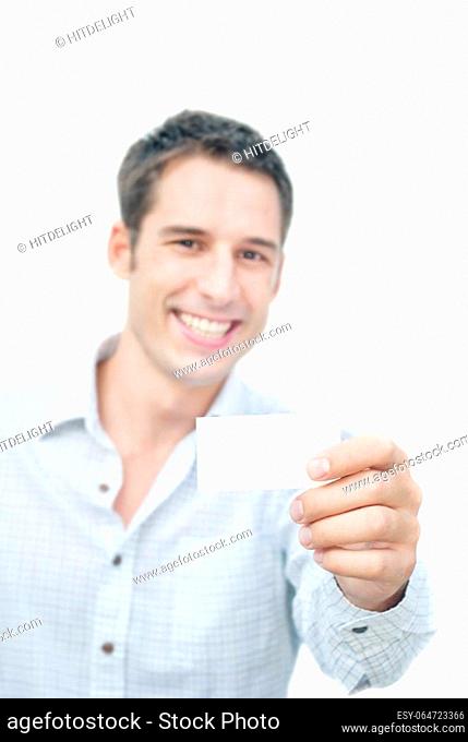 Smiling man showing blank card in his hand