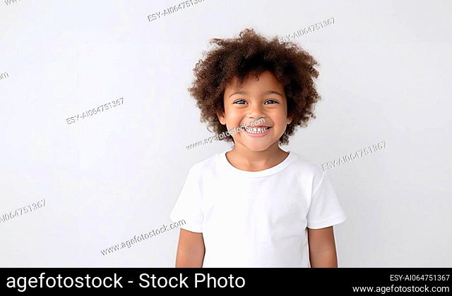 Young African American boy in blank white t-shirt for advertisement or logo. Happy kid, looking at camera with content smile isolated on white background space...