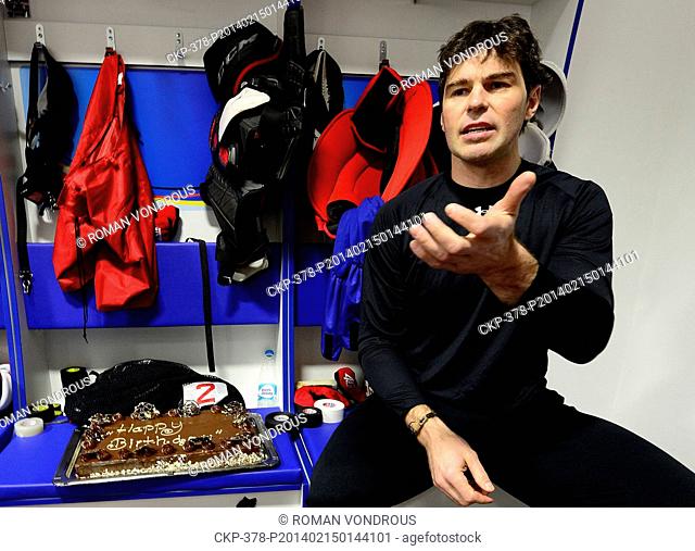 Player of the of Czech ice hockey team for the Winter Olympic Games Jaromir Jagr is seen with a chocolate cake which he got for his 42nd birthday in Sochi