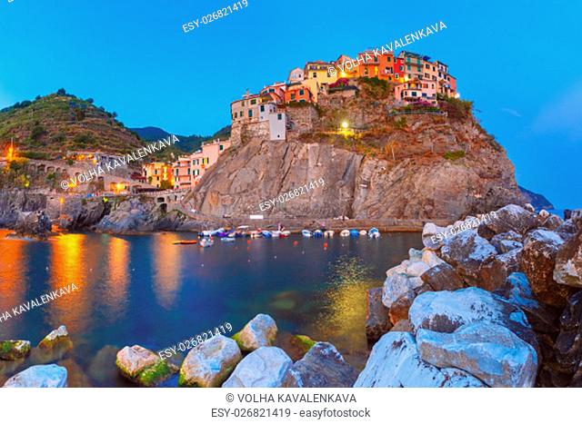 Night view of Manarola fishing village, seascape in Five lands, Cinque Terre National Park, Liguria, Italy