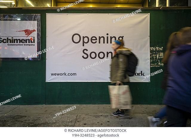 A sign announces the imminent arrival of yet another WeWork co-working space location in Midtown Manhattan in New York on Sunday, December 2, 2018