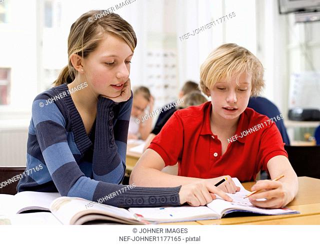 Boy and girl studying