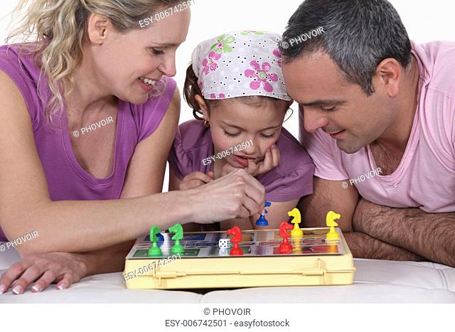 Family playing a board game together