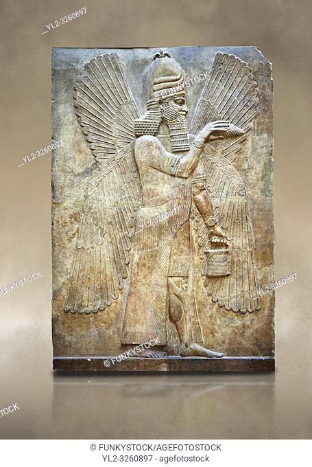 Stone relief sculptured panel of a Genie Blessing. Facade N. Inv AO 19865 from Dur Sharrukin the palace of Assyrian king Sargon II at Khorsabad, 713-706 BC