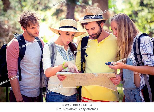 Group of friends looking at map
