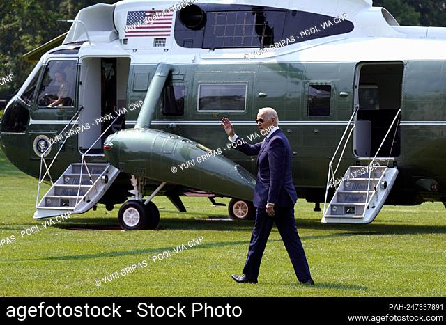 United States President Joe Biden waves as he walks on the South Lawn of the White House in Washington before his departure to Chicago on July 7, 2021