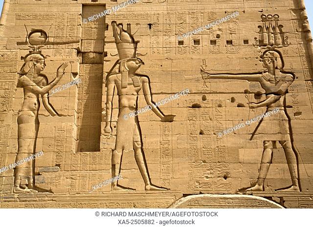 Reliefs of the Goddess Hathor (left) and the God Horus (center) with Neos Dionysos (right), Second Pylon, Temple of Isis, Island of Philae, Aswan, Egypt