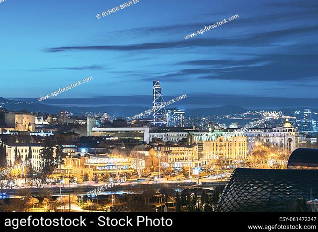Tbilisi, Georgia. modern highrise building in Urban Cityscape during evening lights. Elevated view Tbilisi skyline during sunset