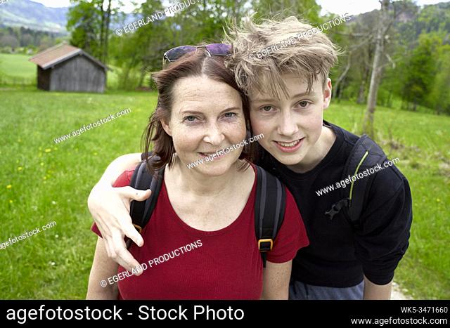 Mature woman and teenager son in the countryside. Bad Tölz, Upper bavaria, Germany