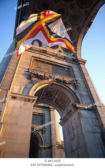 Flag in Triumphal Arch in Cinquantennaire Parc in Brussels , Belgium