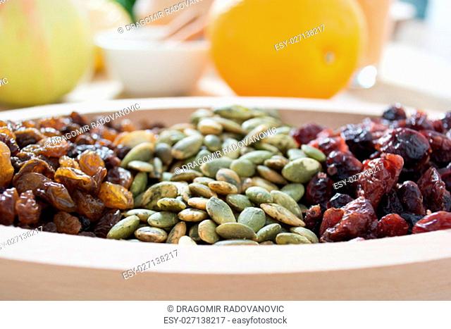 Dry fruit with pumpkin seed in the wooden bowl