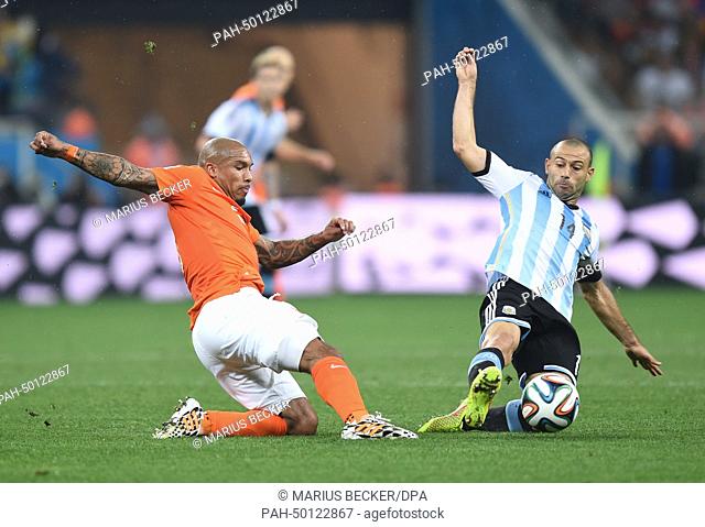Javier Mascherano of Argentina and Nigel de Jong (L) of the Netherlands vie for the ball during the FIFA World Cup 2014 semi-final soccer match between the...