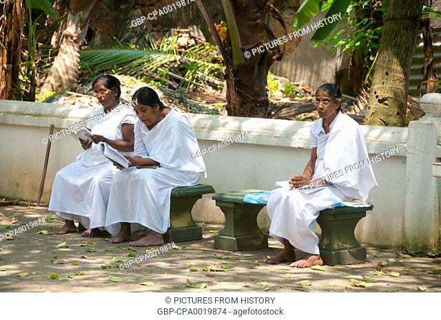 Sri Lanka: Devotees at a Buddhist temple in Mount Lavinia, south of Colombo