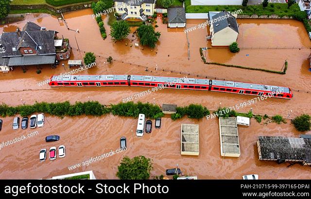 15 July 2021, Rhineland-Palatinate, Kordel: A regional train is in water at the local station. The power went out and the train came to a halt on Wednesday (14