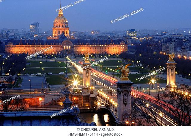 France, Paris, Banks of the Seine River listed as World Heritage by UNESCO, Invalides and the Alexander III Bridge illuminated